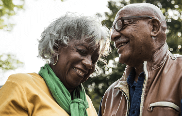Actor portrayal of a woman and a man laughing together