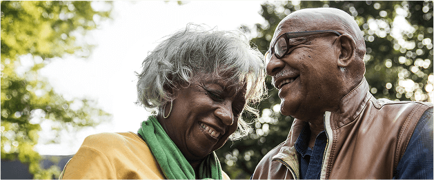 Actor portrayal of a woman and a man laughing together